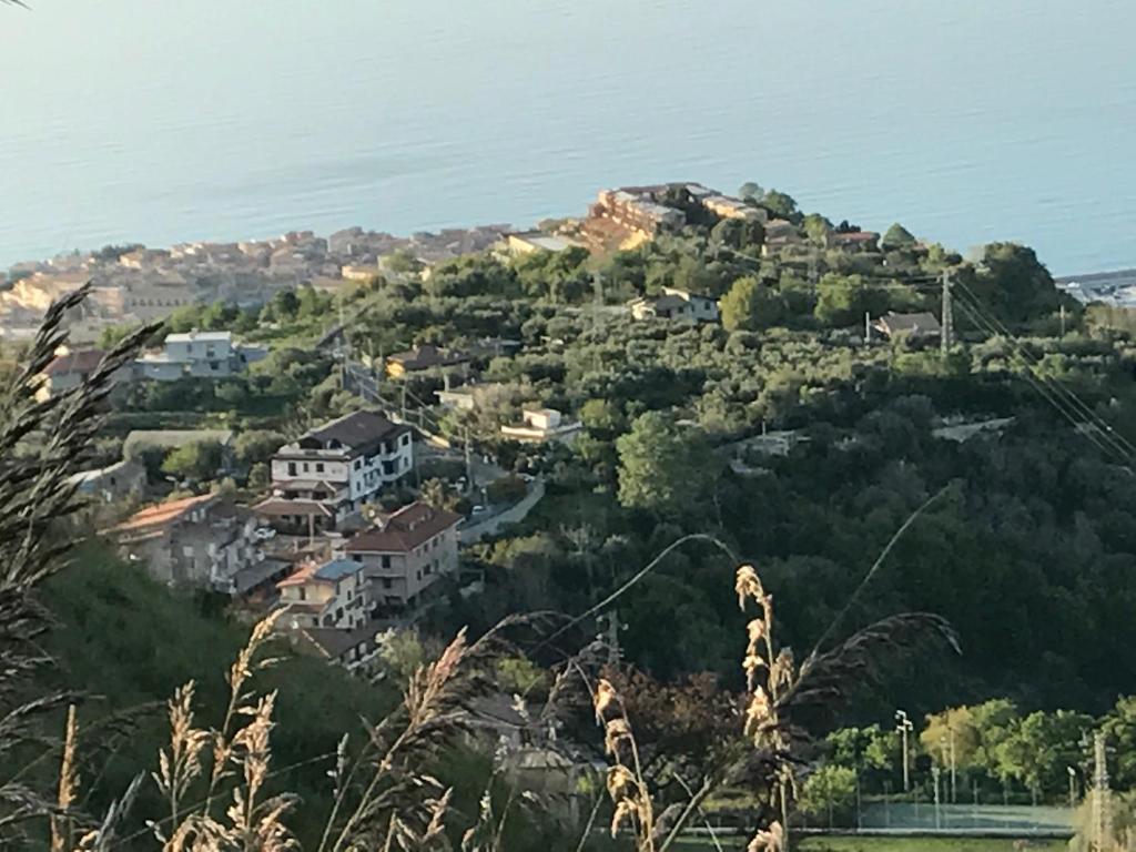 a village on top of a hill with houses at Rosy And Roby in Gasponi