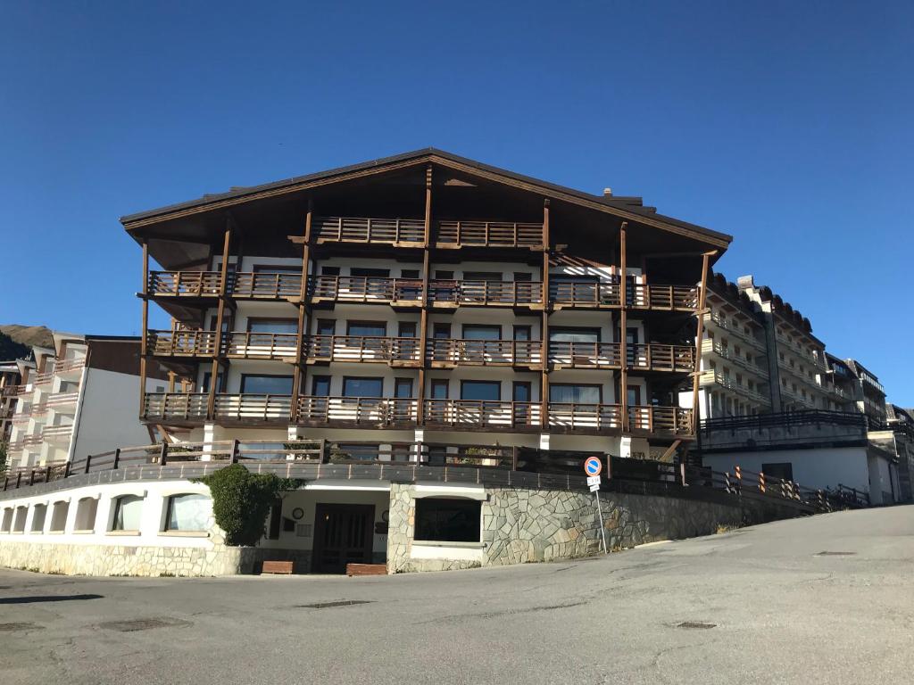 a large building with balconies on the side of it at Royal in Sestriere