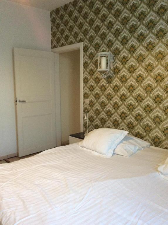 Postel nebo postele na pokoji v ubytování Beaux Temps b&b