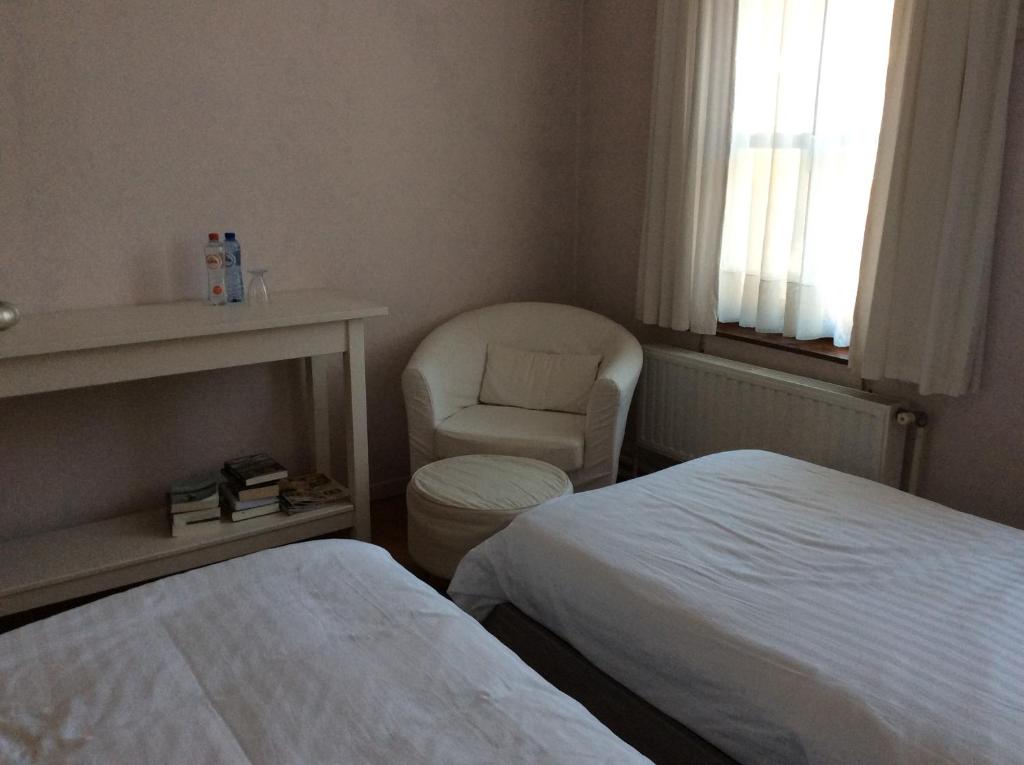 Postel nebo postele na pokoji v ubytování Beaux Temps b&b