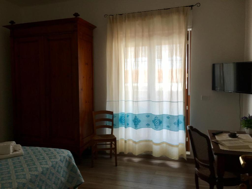 Postel nebo postele na pokoji v ubytování Su Corittu Guesthouse