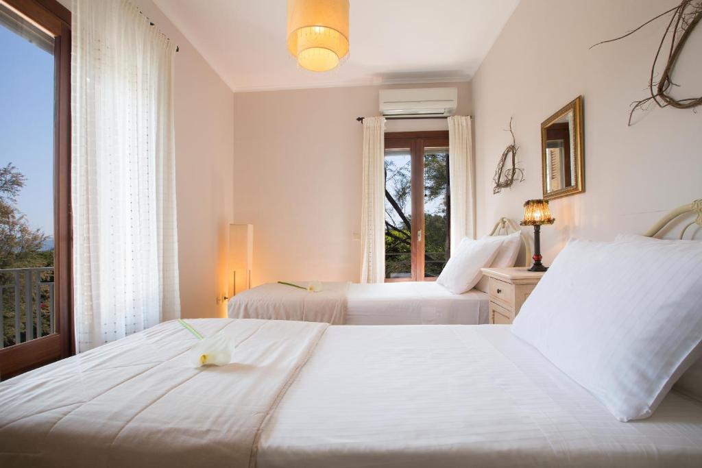 Posteľ alebo postele v izbe v ubytovaní Aeriko Homes of Distinction