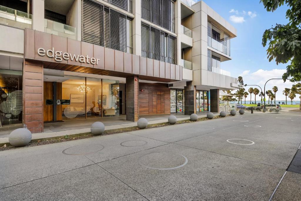 an empty street in front of a building at Edgewater 108 in Geelong