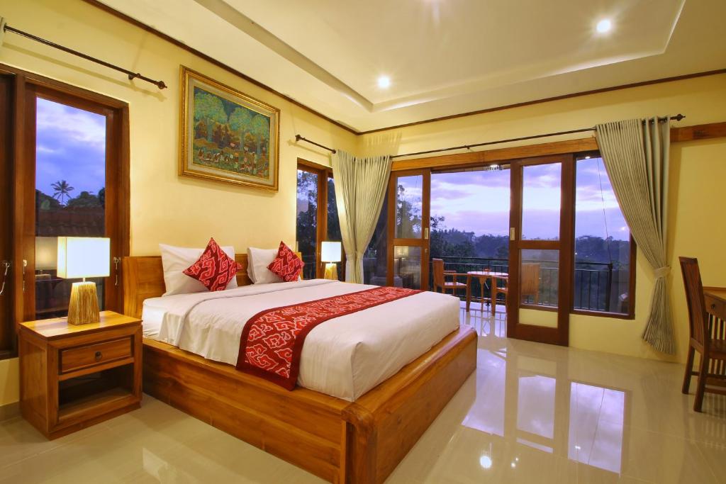 Postel nebo postele na pokoji v ubytování Ubud Sky
