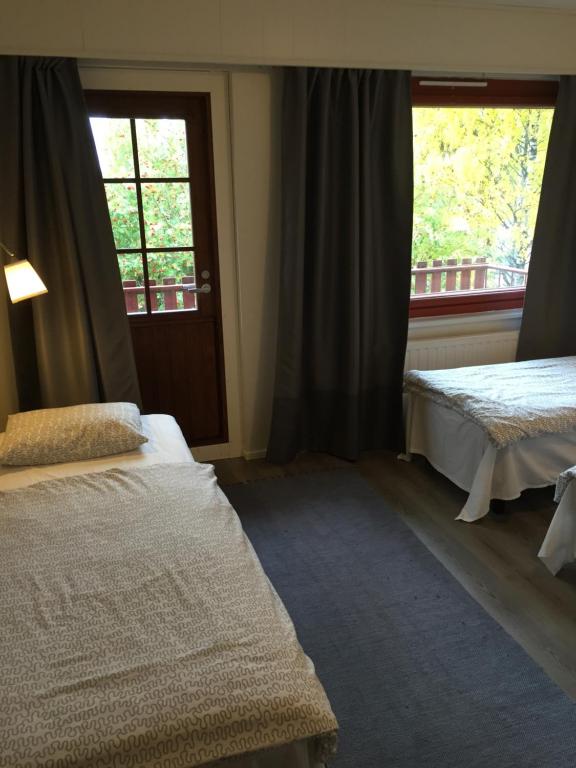 Postel nebo postele na pokoji v ubytování Guesthouse Borealis