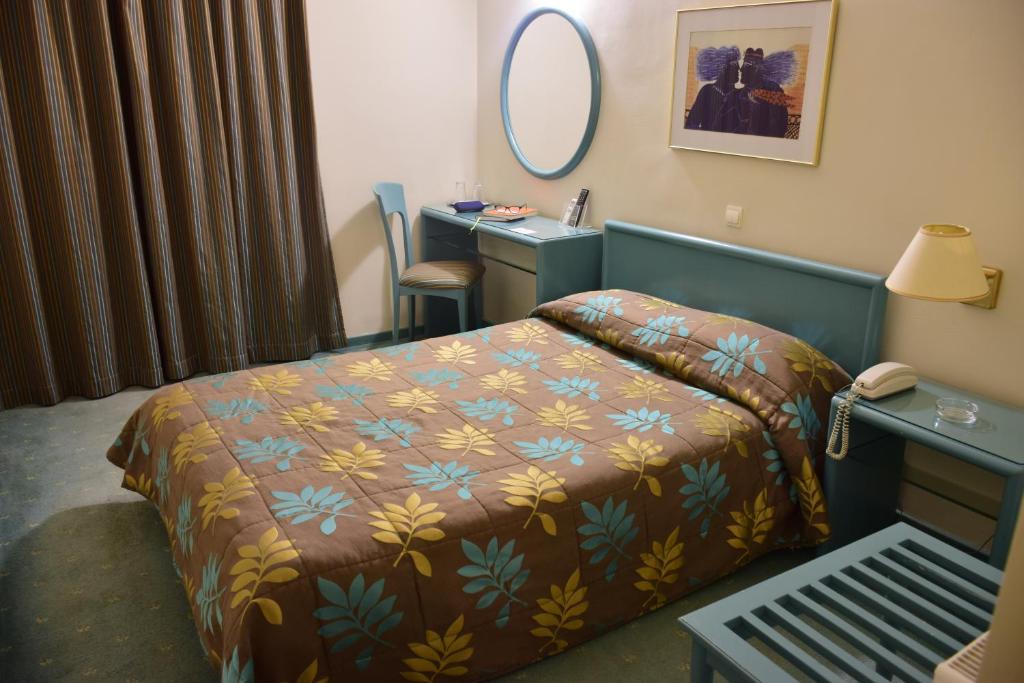 Postel nebo postele na pokoji v ubytování Hotel Galaxias