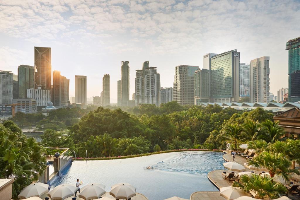 a view from a balcony overlooking a city at Mandarin Oriental, Kuala Lumpur in Kuala Lumpur