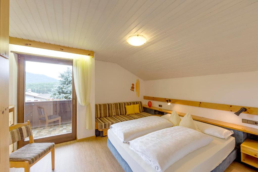 Postel nebo postele na pokoji v ubytování Appartements Erika