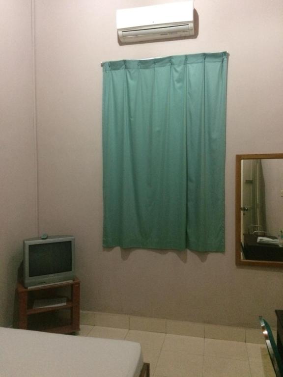 TV a/nebo společenská místnost v ubytování Wisma Maharani