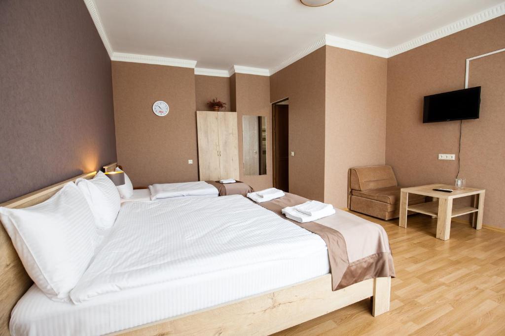 Voodi või voodid majutusasutuse Hotel Almi toas