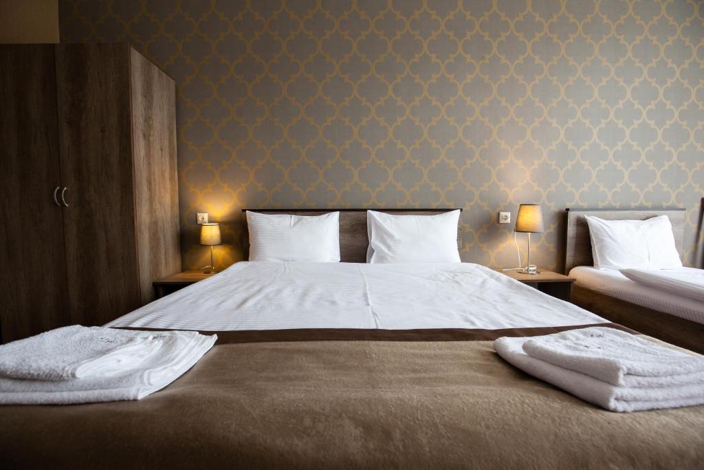 Voodi või voodid majutusasutuse Hotel Almi toas