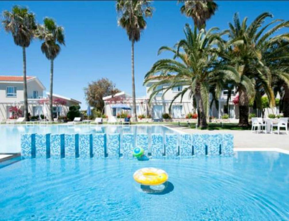 a yellow frisbee in the middle of a swimming pool at Mon Repos Hotel in Ayia Napa