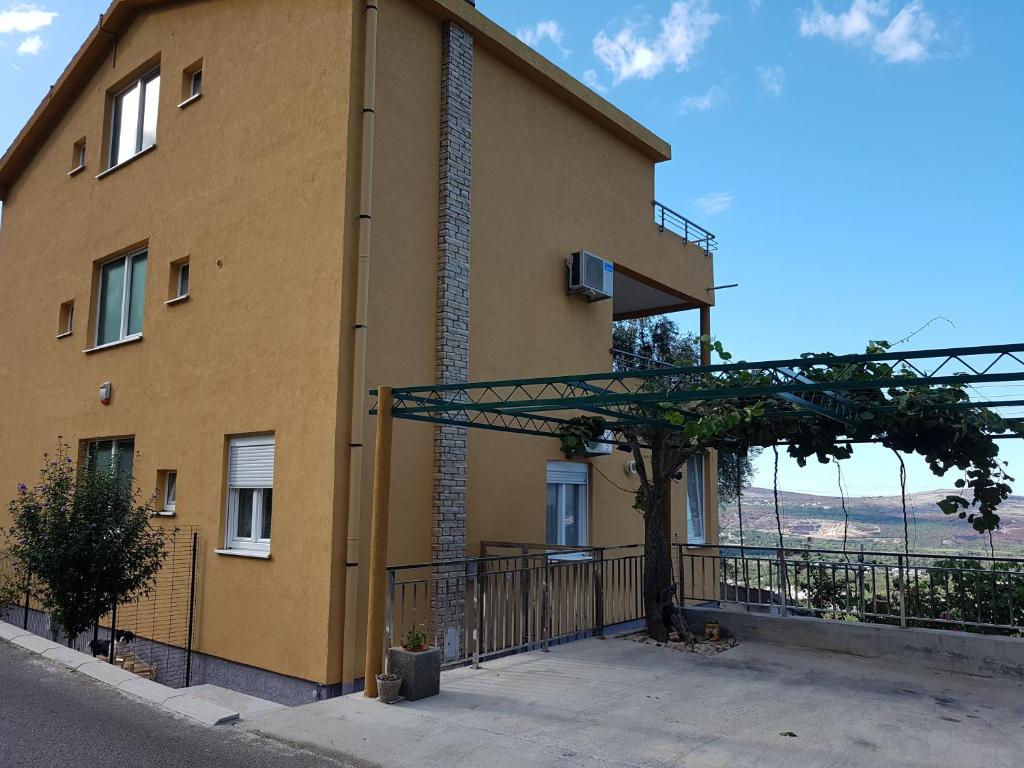 a building with a tree in front of it at Apartment Panorama in Kotor
