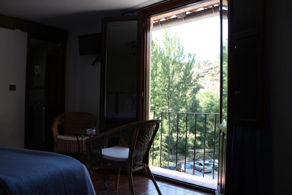 Posezení v ubytování Hotel Mesón del Gallo