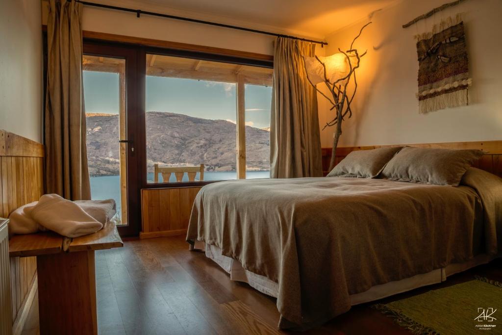 Postel nebo postele na pokoji v ubytování Mallin Colorado Ecolodge