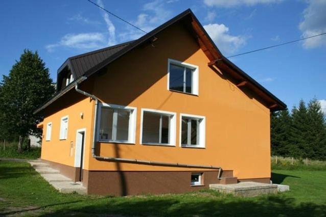 a small house with an orange at Apartments Nino in Jasenak