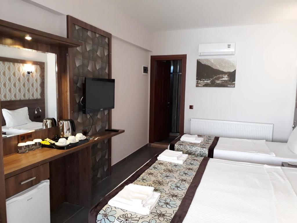Postel nebo postele na pokoji v ubytování Dolphin Apart Hotel