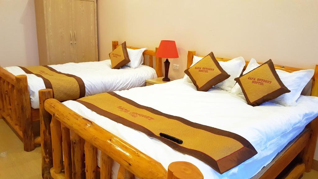 Postel nebo postele na pokoji v ubytování Sapa Odyssey Hostel