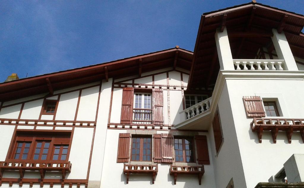 a building with balconies on the side of it at Erlande Baïta in Urrugne