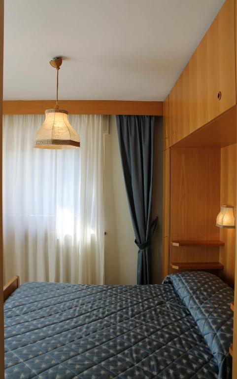 Postel nebo postele na pokoji v ubytování Punta Margherita