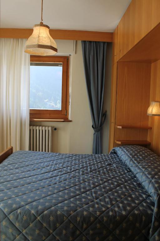 Postel nebo postele na pokoji v ubytování Punta Margherita