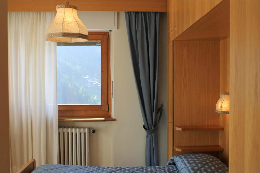 Postel nebo postele na pokoji v ubytování Punta Margherita