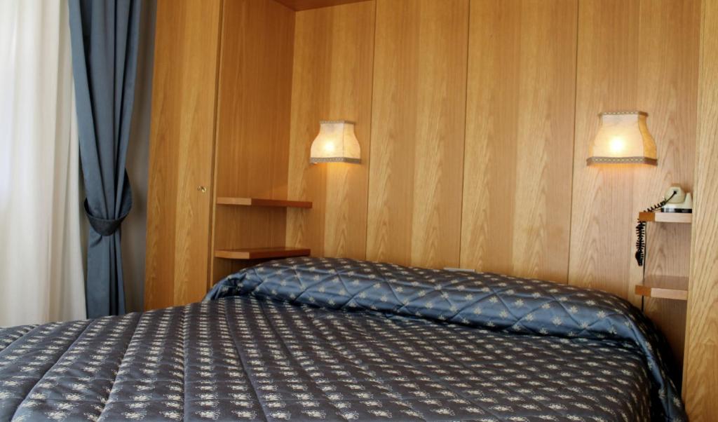 Postel nebo postele na pokoji v ubytování Punta Margherita