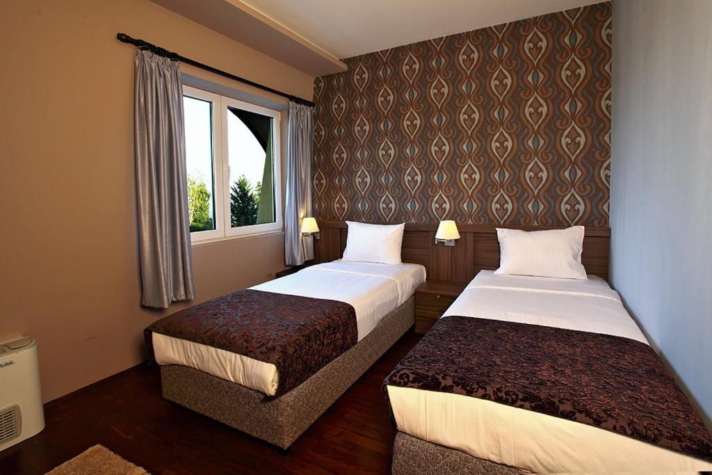 Postel nebo postele na pokoji v ubytování Hotel Šator