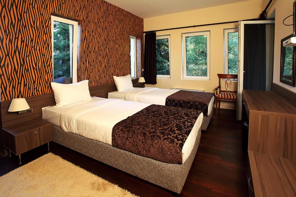 Postel nebo postele na pokoji v ubytování Hotel Šator