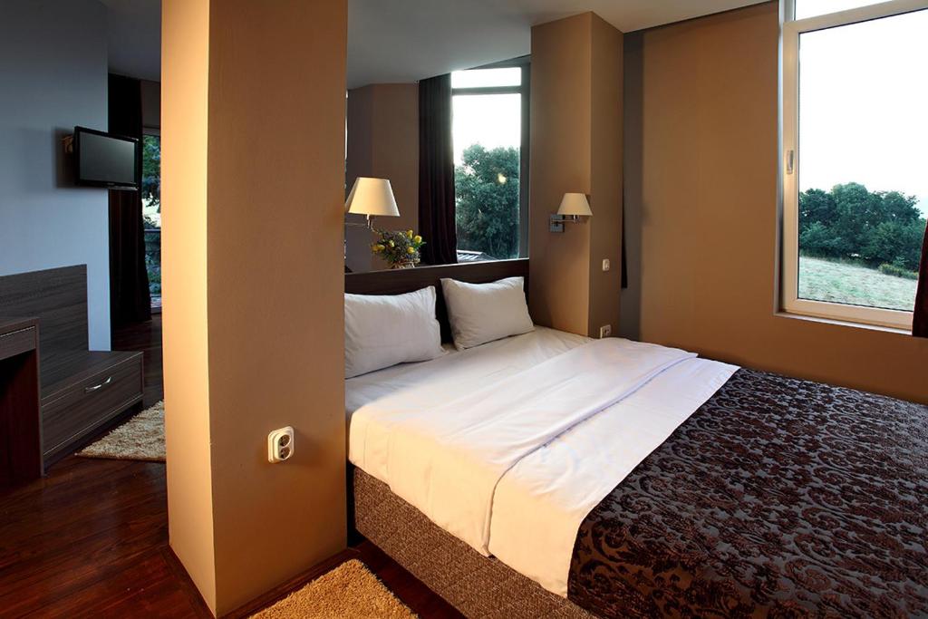 Postel nebo postele na pokoji v ubytování Hotel Šator