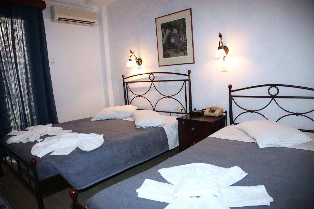 Postel nebo postele na pokoji v ubytování Nikolas Hotel