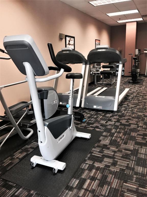 a gym with several exercise bikes in a room at Lake Buena Vista Resort Village and Spa, Near Disney in Orlando
