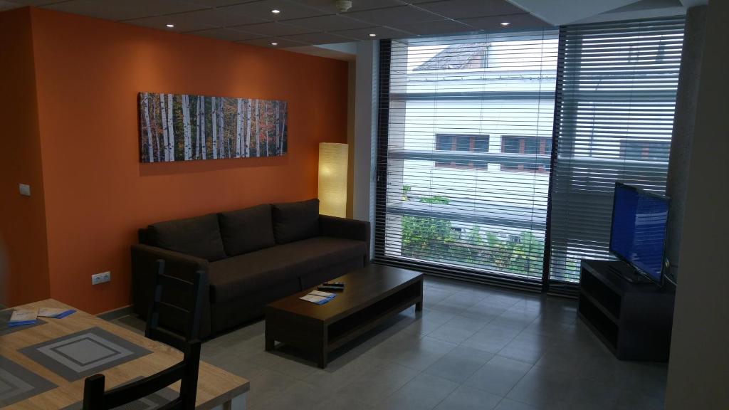 a living room with a couch and a coffee table at Studio Loft Fuerteventura in Puerto del Rosario