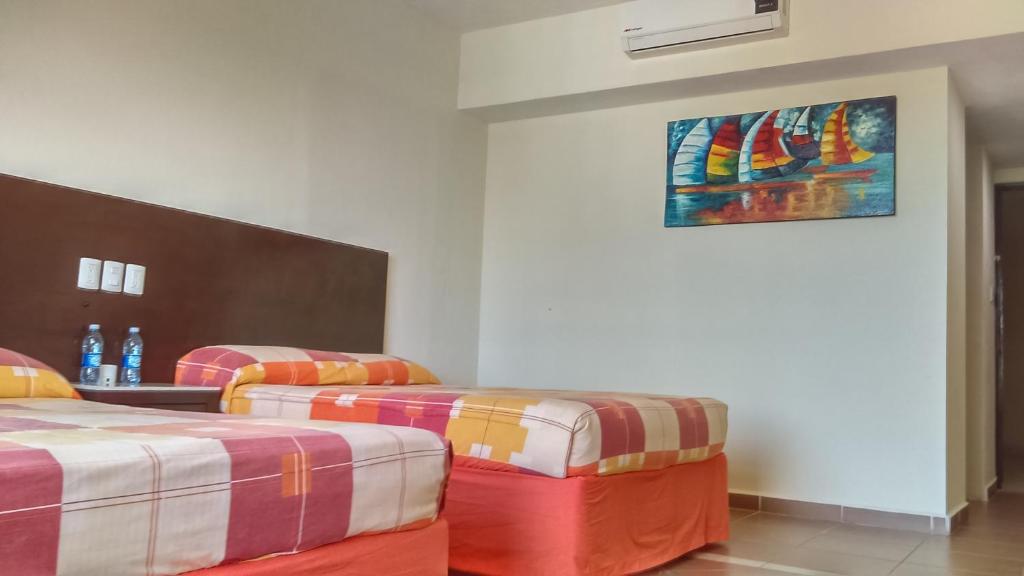 Postel nebo postele na pokoji v ubytování Hotel Bogavante
