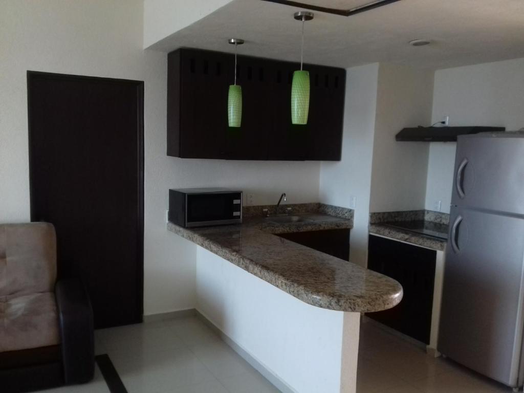 Kuchyň nebo kuchyňský kout v ubytování Hotel Bogavante