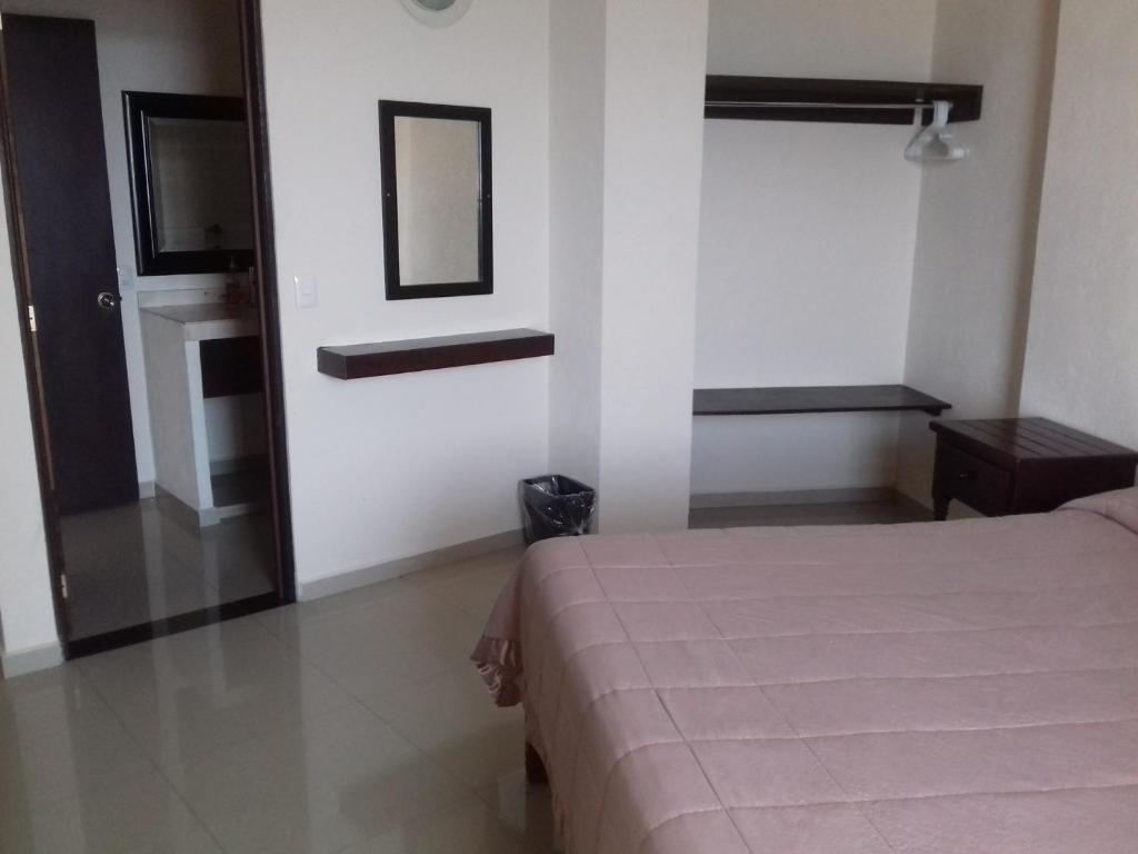Postel nebo postele na pokoji v ubytování Hotel Bogavante