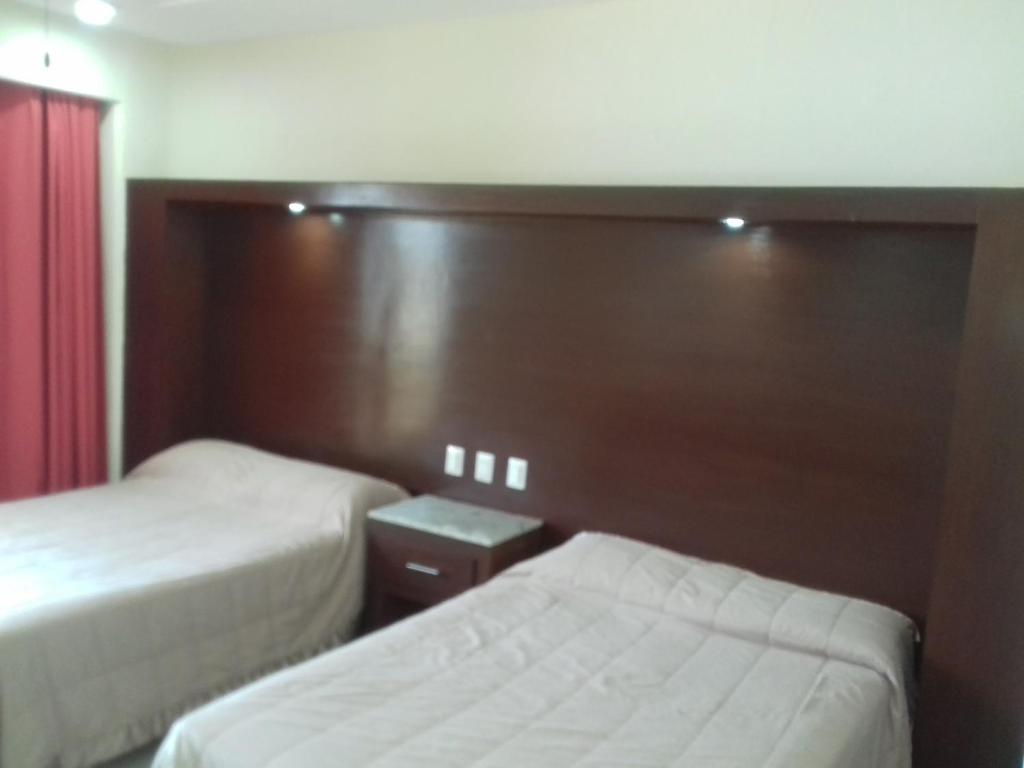 Postel nebo postele na pokoji v ubytování Hotel Bogavante
