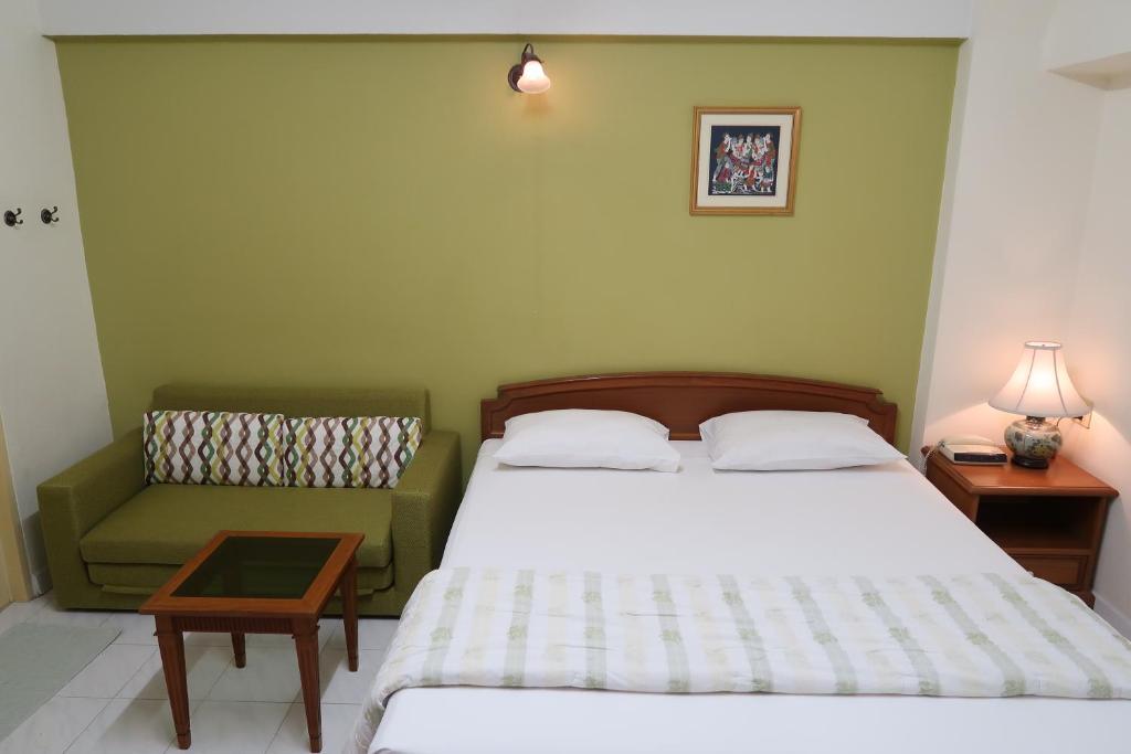 Postel nebo postele na pokoji v ubytování Phawana Sweet Hotel