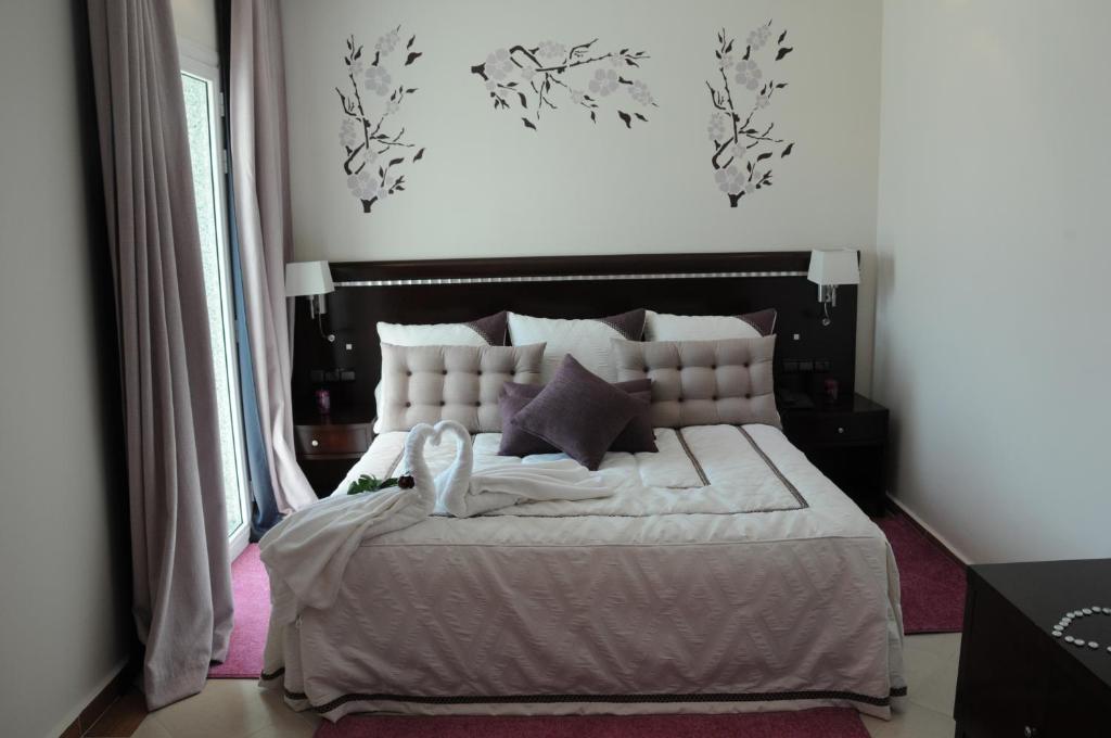 Postel nebo postele na pokoji v ubytování Dream's Hotel