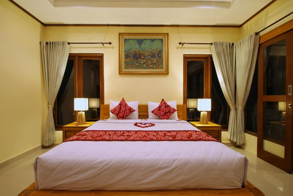 Postel nebo postele na pokoji v ubytování Ubud Sky