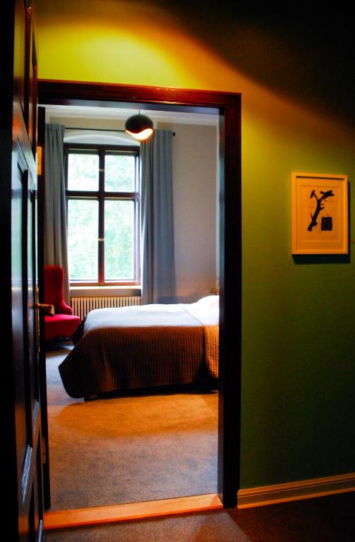 Postel nebo postele na pokoji v ubytování Romantik Hotel Schloss Reichenow