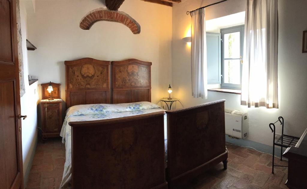Postel nebo postele na pokoji v ubytování Agriturismo Podere Alberese