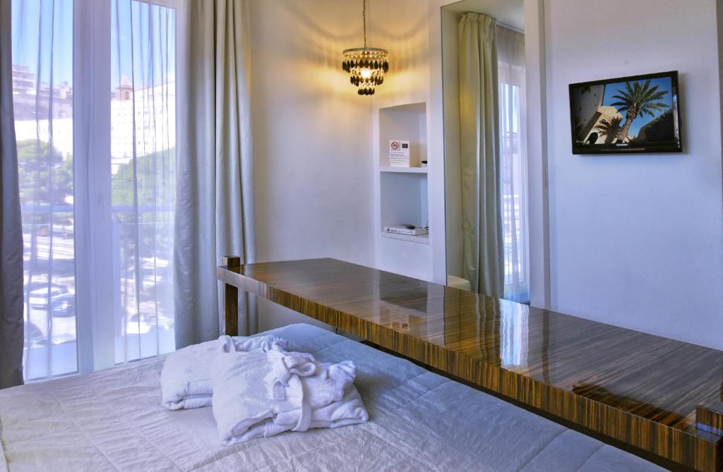 Postel nebo postele na pokoji v ubytování Hotel Exclusive