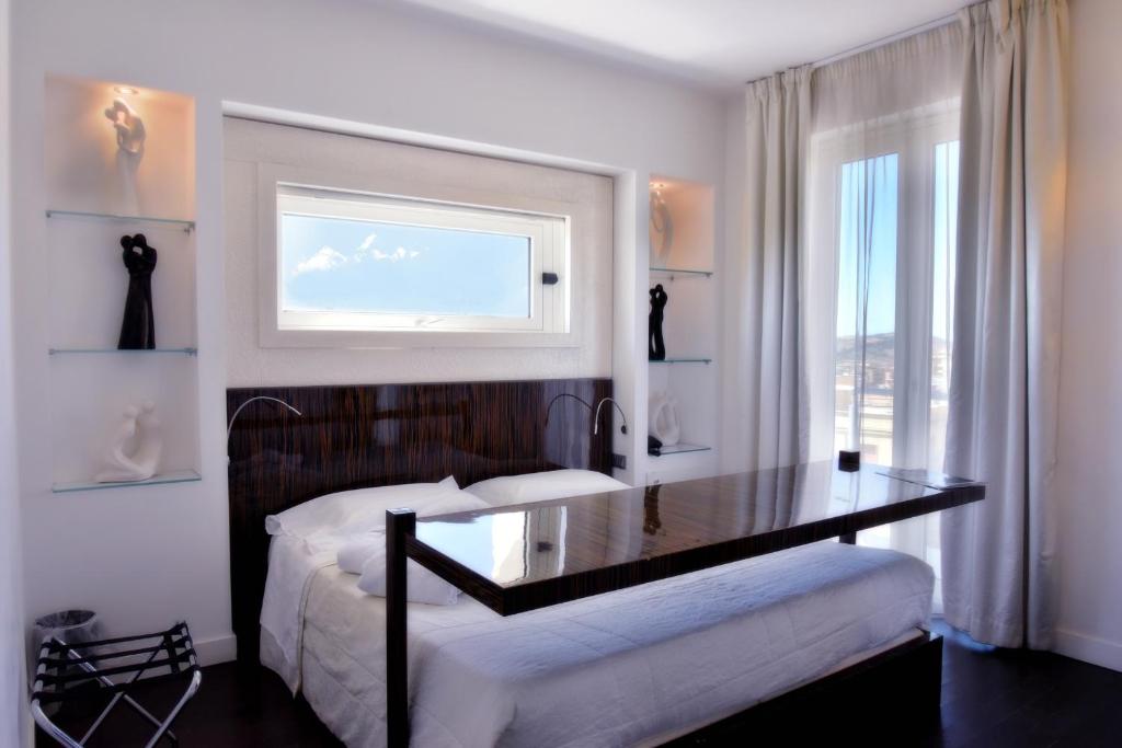 Postel nebo postele na pokoji v ubytování Hotel Exclusive