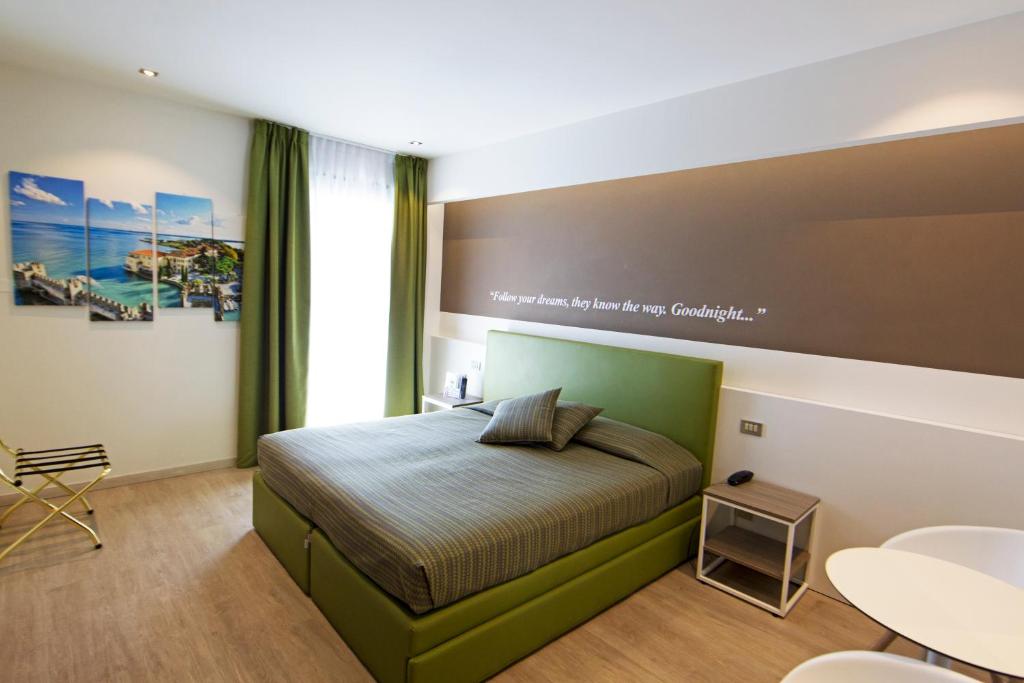 Postel nebo postele na pokoji v ubytování Hotel Ideal