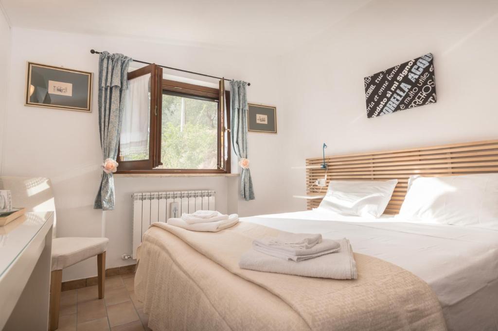 Postel nebo postele na pokoji v ubytování B&B Cantico Delle Creature
