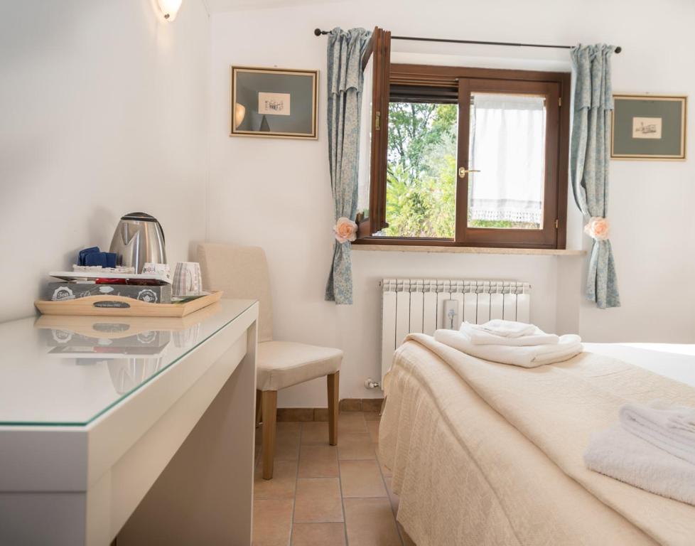 Postel nebo postele na pokoji v ubytování B&B Cantico Delle Creature
