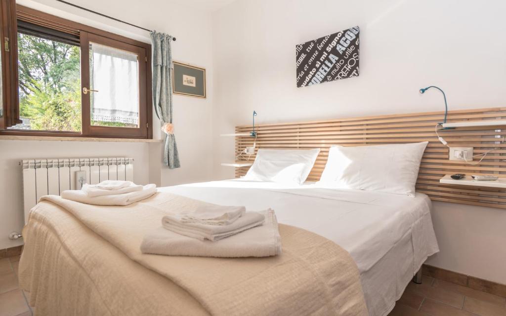 Postel nebo postele na pokoji v ubytování B&B Cantico Delle Creature