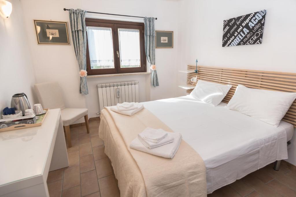 Postel nebo postele na pokoji v ubytování B&B Cantico Delle Creature