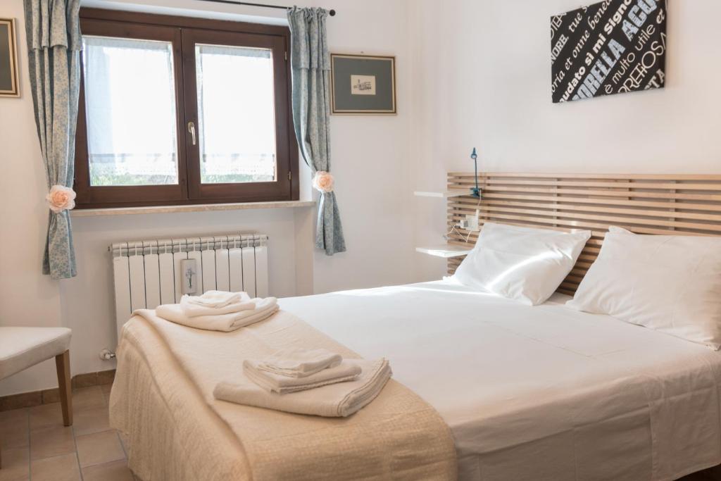 Postel nebo postele na pokoji v ubytování B&B Cantico Delle Creature